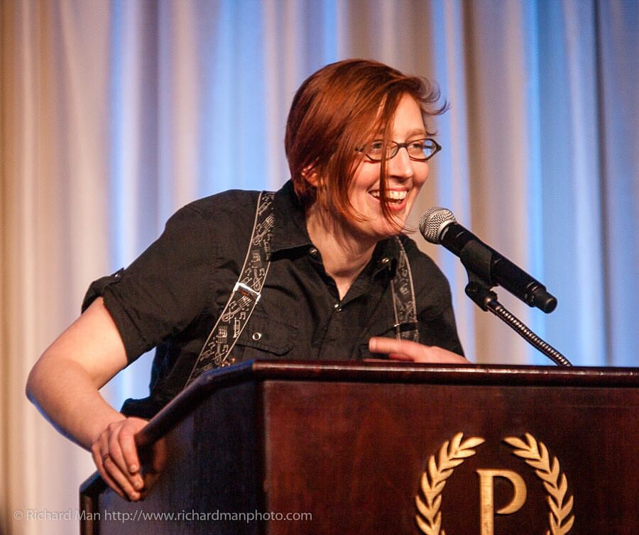 Photo of Liz Argall accepting an award on behalf of Mad Max Fury Road.